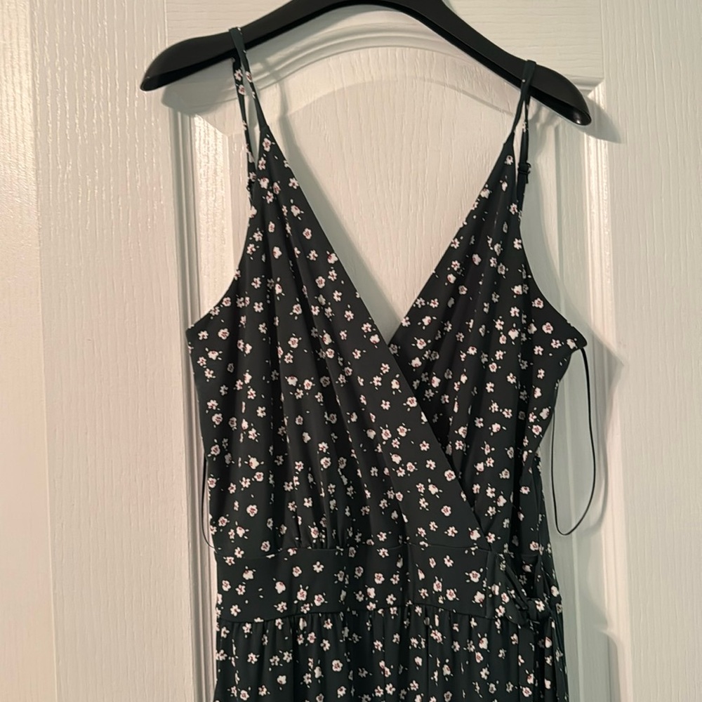 Jumpsuit, size medium flower print, green background, flowy pant legs